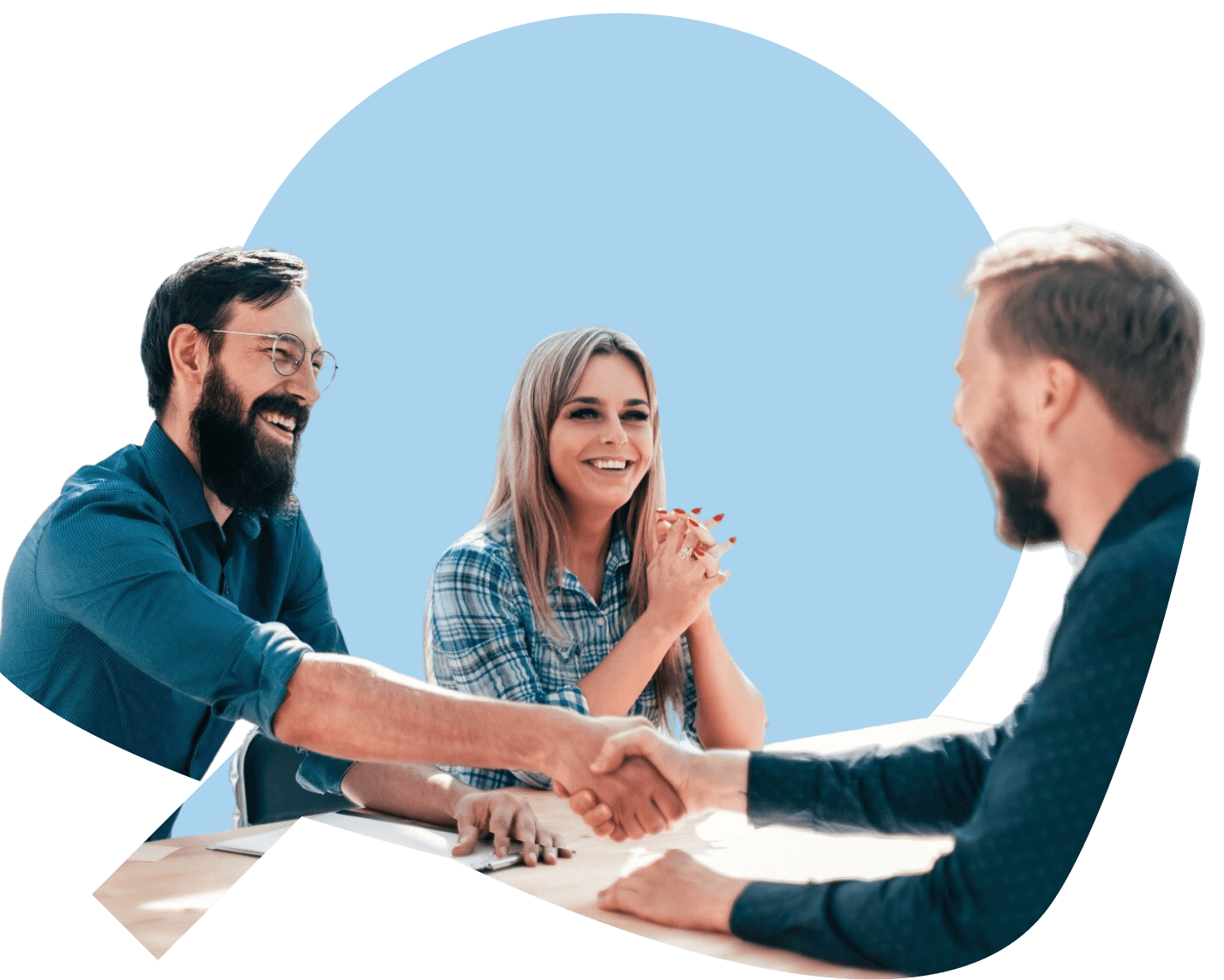Man smiling while looking at his phone